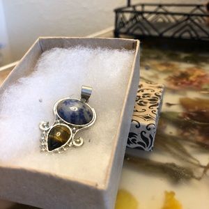 Natural stone pendant with silver metal